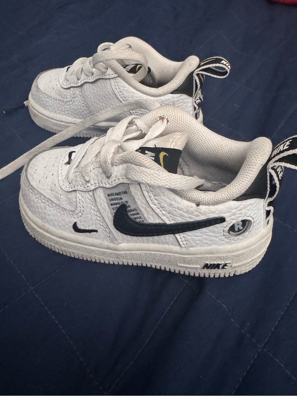 Nike White Kids Sneakers with Black Swoosh Accent